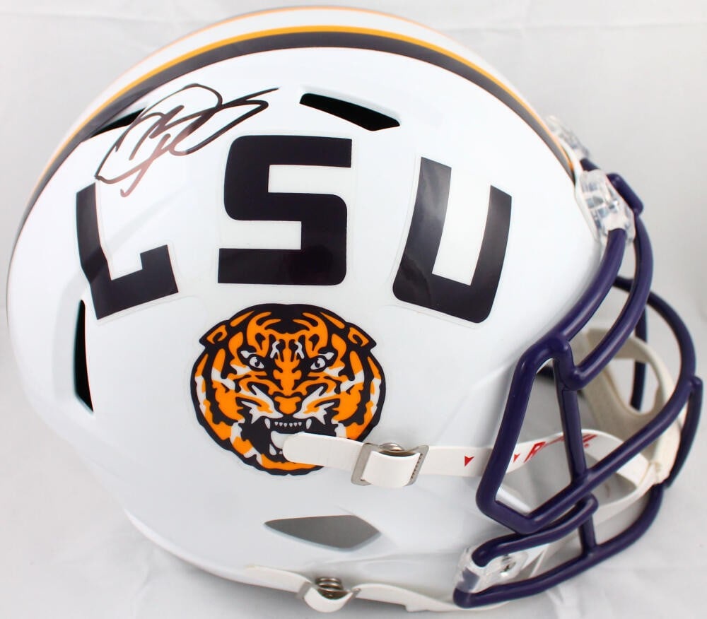 Odell Beckham Jr Signed LSU Tigers Speed Helmet Beckett Auth: Odell Beckham Jr Signed LSU Tigers Speed Helmet Beckett Auth This is an original LSU Tigers full-size white speed helmet signed by Odell Beckham Jr., a prominent football player. The helmet features a