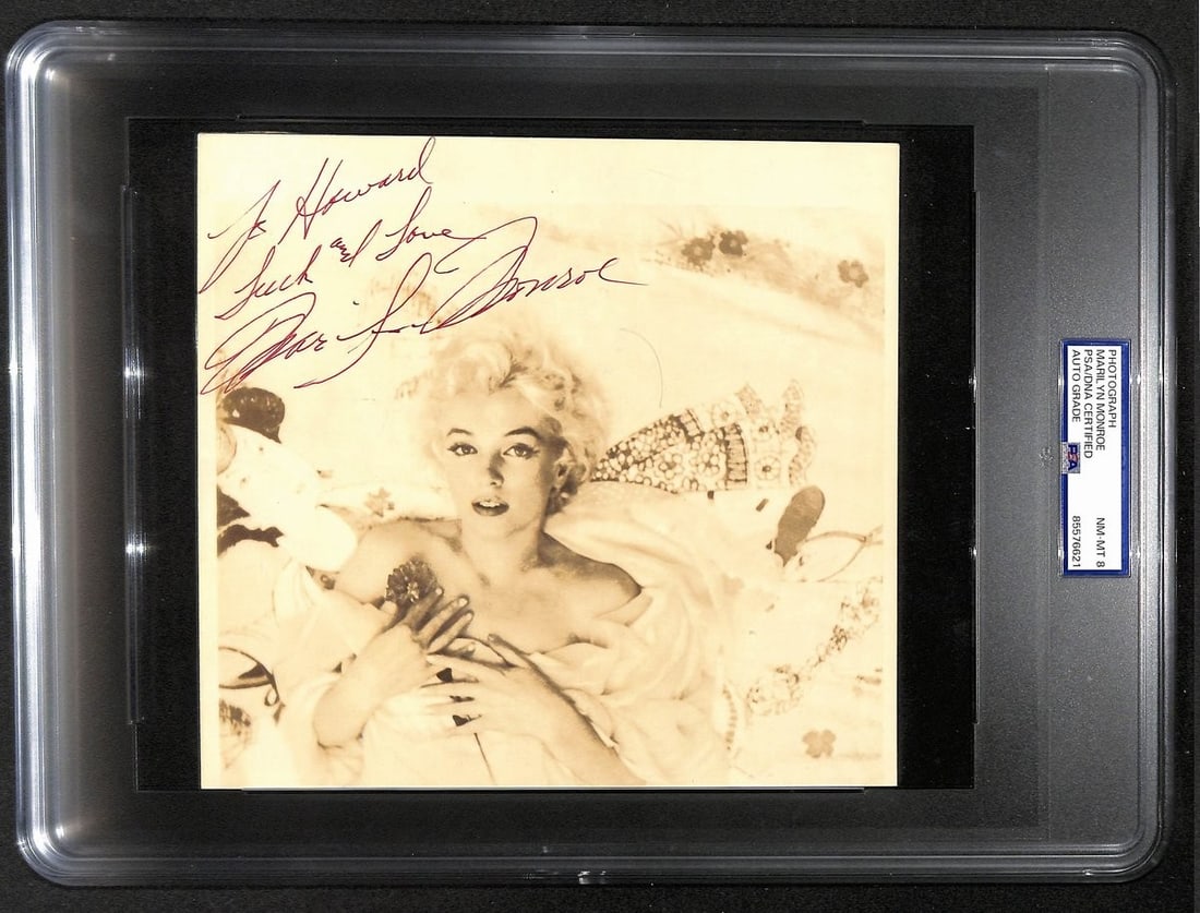 Marilyn Monroe Signed 1956 Ambassador Hotel Photo PSA/DNA NM-MT 8: Marilyn Monroe Signed 1956 Ambassador Hotel Photo PSA/DNA NM-MT 8 This remarkable photograph features a sepia-tone image of Marilyn Monroe, measuring 8" x 7.5". It is personally signed by Monroe with