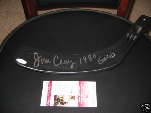 Jim Craig 1980 Gold Medal Signed Hockey Stick: Jim Craig 1980 Gold Medal Signed Hockey Stick This is an original signed hockey stick by Jim Craig, a notable player from the 1980 NHL season. This pre-owned stick is a fantastic collectible for hocke