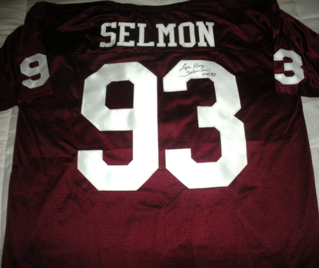 Lee Roy Selmon Oklahoma Sooners Signed Russell Jersey with COA: Lee Roy Selmon Oklahoma Sooners Signed Russell Jersey with COA Celebrate the legacy of Lee Roy Selmon with this officially licensed Russell jersey, featuring his signature. This original piece is a mu