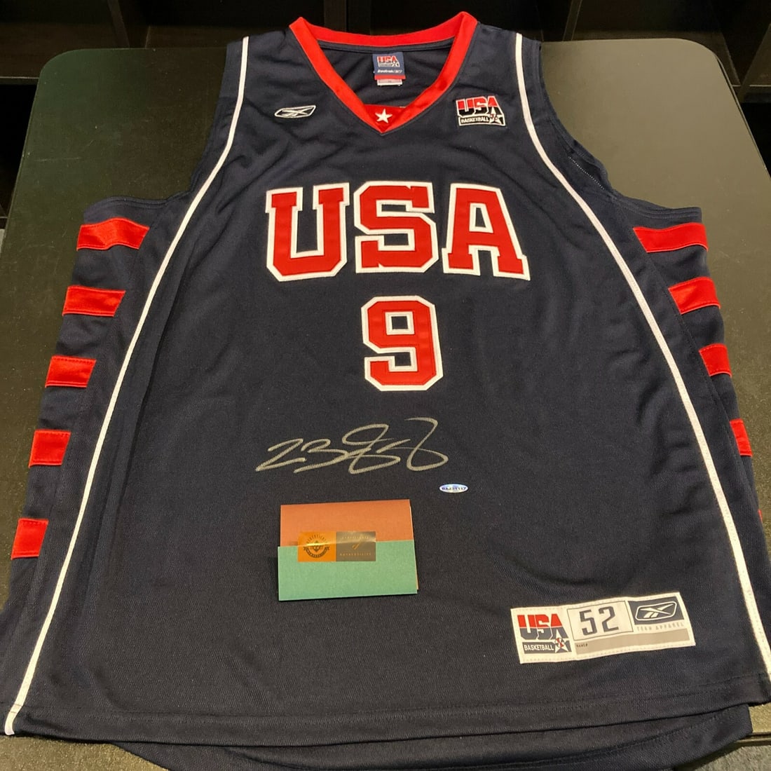Autographed 2004 Team USA Olympic Jersey LeBron James UDA PSA DNA Certified: Autographed 2004 Team USA Olympic Jersey LeBron James UDA PSA DNA Certified This is an authentic 2004 Team USA Olympics basketball jersey signed by LeBron James. The jersey, produced by Reebok in size