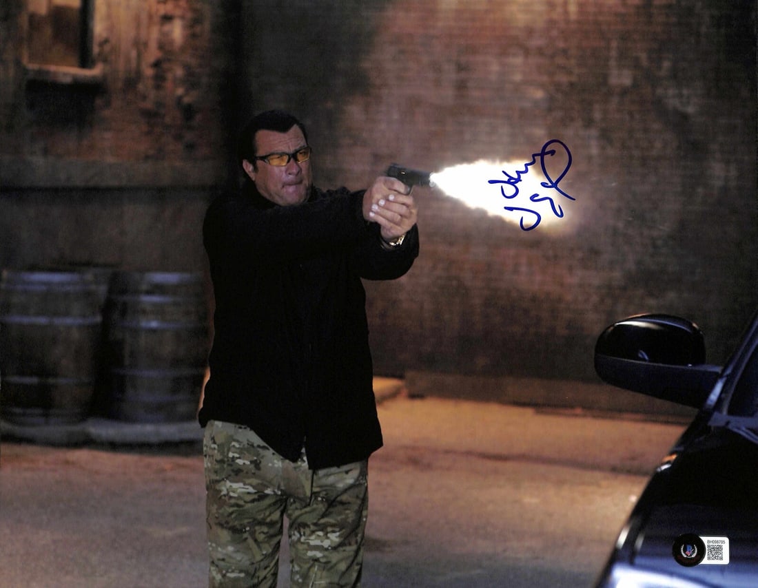 Steven Seagal On Deadly Ground Signed 11x14 Photo Certified Beckett: Steven Seagal On Deadly Ground Signed 11x14 Photo Certified Beckett This autographed 11x14 color photograph features actor Steven Seagal, known for his role in the movie On Deadly Ground. The signatur