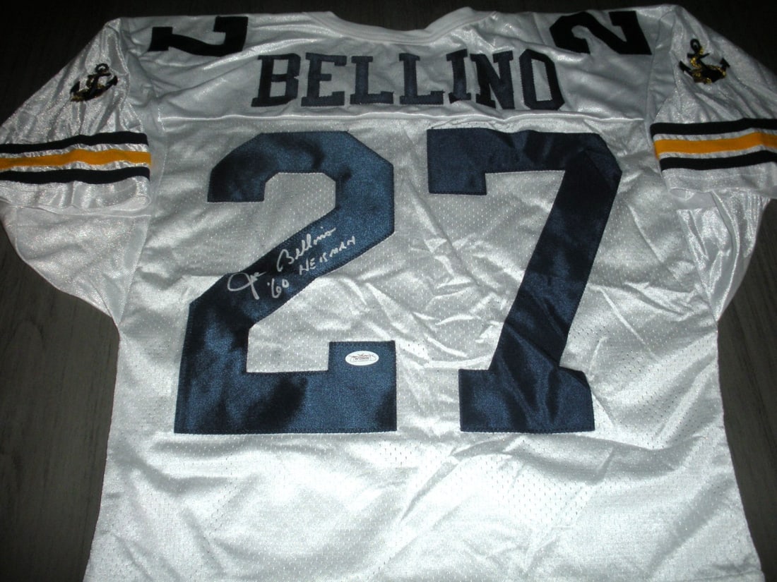 Joe Bellino Signed Navy Midshipmen Wilson Jersey with JSA COA: Joe Bellino Signed Navy Midshipmen Wilson Jersey with JSA COA This official licensed Wilson jersey is signed by Joe Bellino, a distinguished player from the Navy Midshipmen football team. The jersey i
