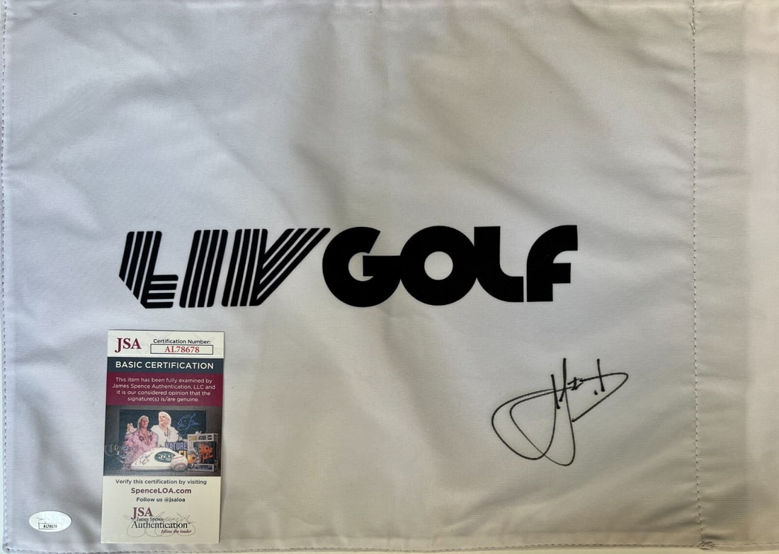 Cam Smith Signed LIV Golf #18 Pin Flag with JSA Authentication: Cam Smith Signed LIV Golf #18 Pin Flag with JSA Authentication This is an officially licensed LIV Golf #18 pin flag, personally signed by PGA star Cam Smith. The autograph has been authenticated by Ja