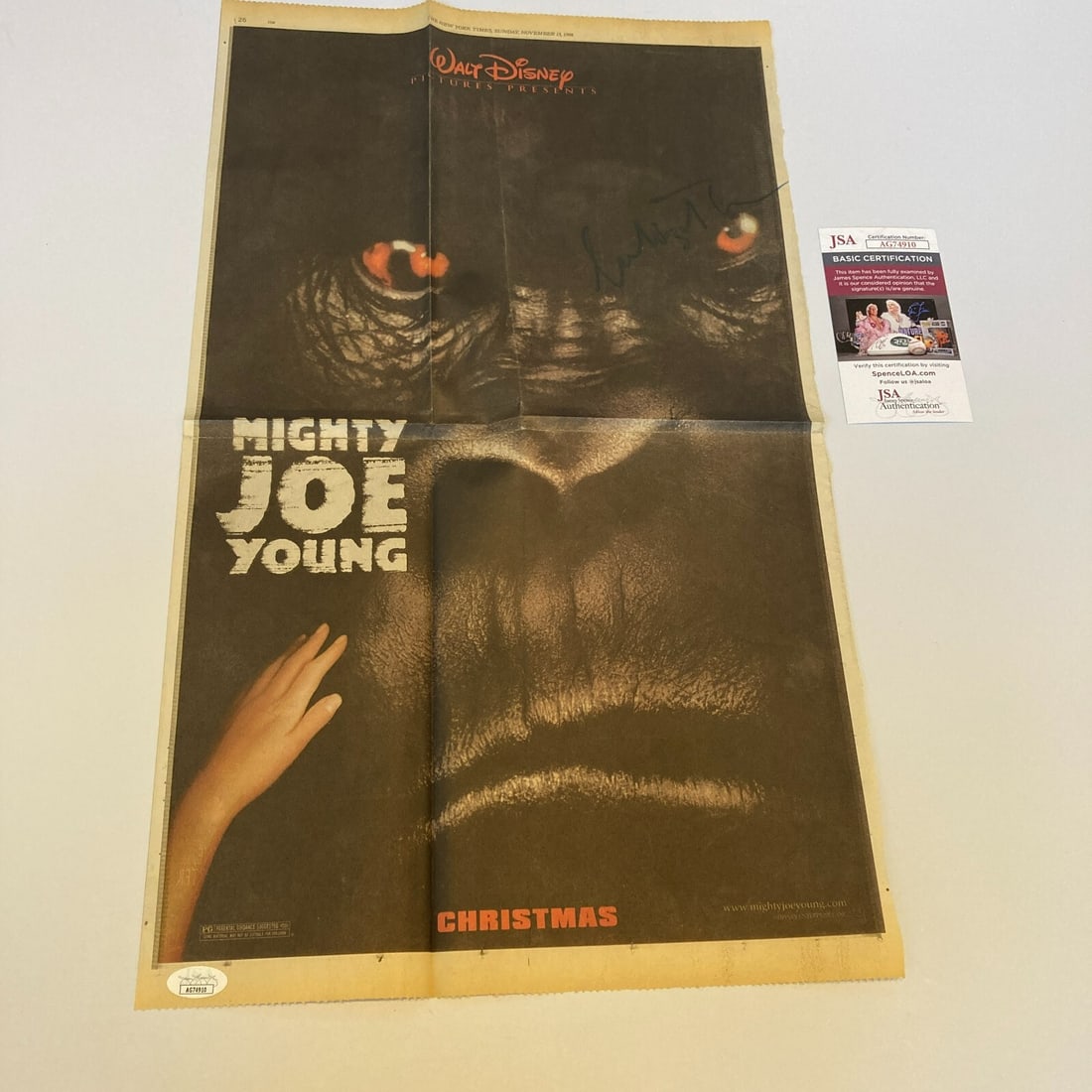 Charlize Theron Signed Mighty Joe Young Movie Poster JSA Certified: Charlize Theron Signed Mighty Joe Young Movie Poster JSA Certified This is a large newspaper movie poster for "Mighty Joe Young," featuring the signature of Charlize Theron. The autograph has been aut