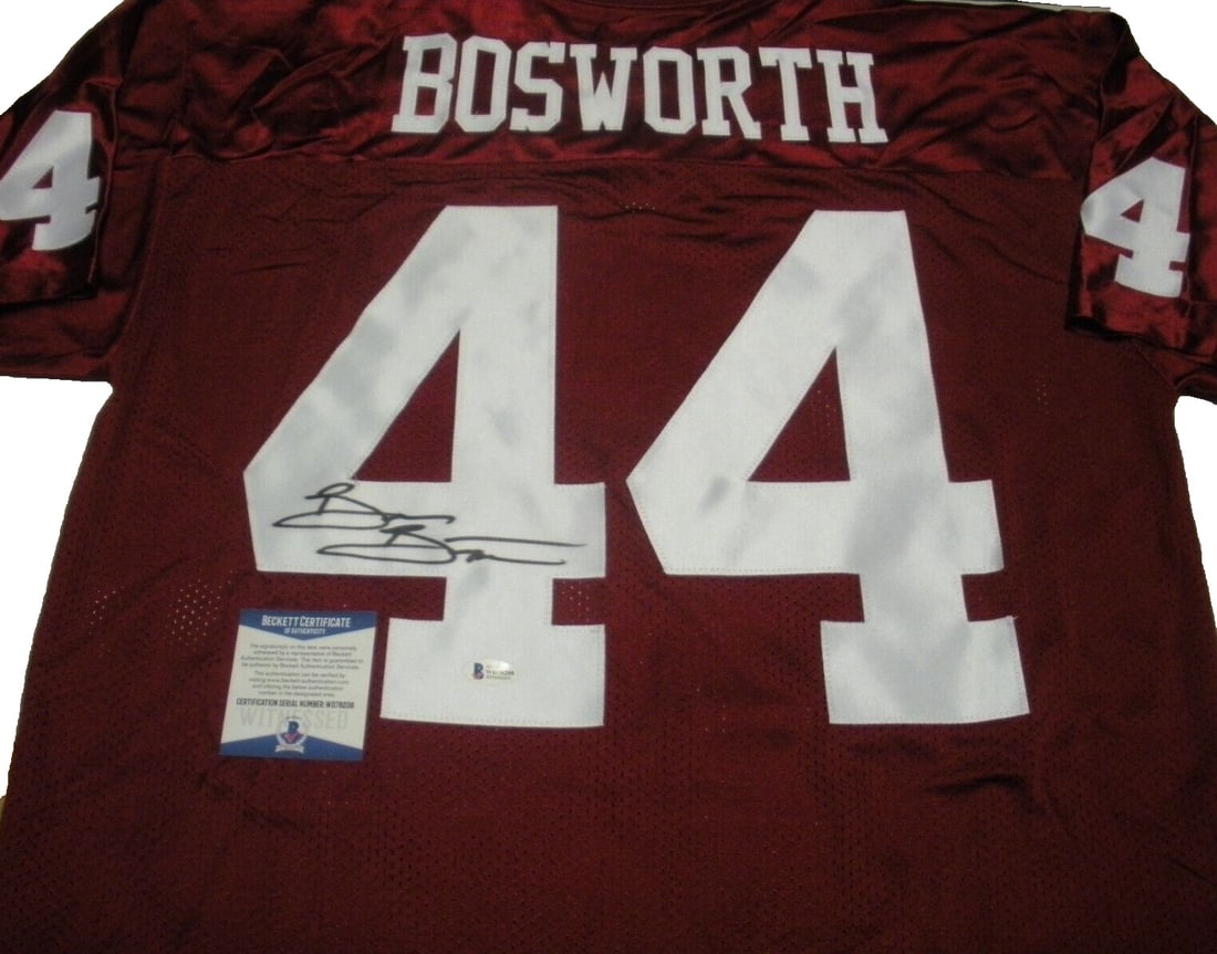 Brian Bosworth Signed Oklahoma Russell Jersey with COA: Brian Bosworth Signed Oklahoma Russell Jersey with COA This officially licensed Russell jersey features the signature of Brian Bosworth, a notable player from Oklahoma. The jersey is in pre-owned cond