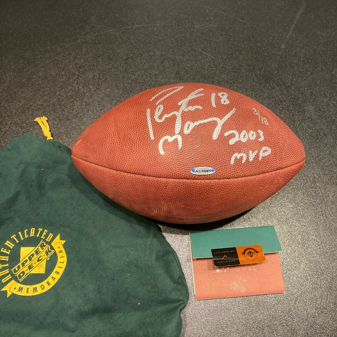 Peyton Manning Signed Wilson NFL Game Football 2003 MVP UDA COA: Peyton Manning Signed Wilson NFL Game Football 2003 MVP UDA COA This is a pre-owned Wilson NFL game football signed by Peyton Manning, featuring his jersey number '#18' and commemorating his 2003 MVP