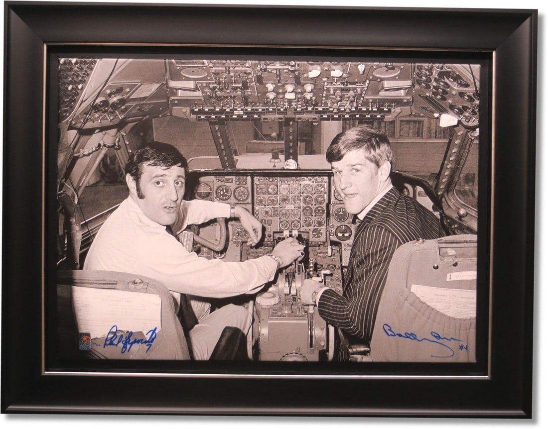 Bobby Orr Phil Esposito Signed Canvas 28x36 Limited Edition #/44: Bobby Orr Phil Esposito Signed Canvas 28x36 Limited Edition #/44 This stunning framed canvas features hockey legends Bobby Orr and Phil Esposito in a unique moment titled "In The Cockpit." Measuring 2