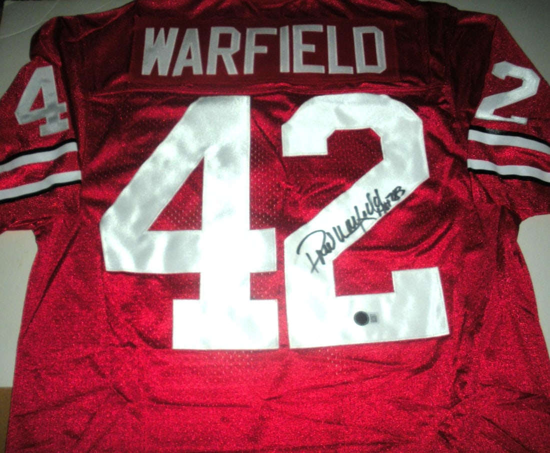 Paul Warfield Signed Ohio State Nike Jersey with COA: Paul Warfield Signed Ohio State Nike Jersey with COA This officially licensed Nike jersey is a remarkable piece of memorabilia, signed by Paul Warfield, a legendary player from Ohio State. Ideal for c