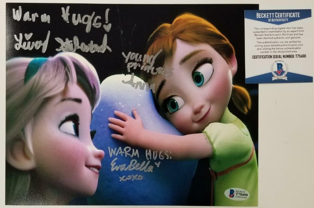 Disney Frozen Signed 8x10 Photo by Livvy Stubenrauch and Eva Bella: Disney Frozen Signed 8x10 Photo by Livvy Stubenrauch and Eva Bella This original 8x10 photograph features the beloved Disney characters Elsa and Anna, beautifully captured and signed by Livvy Stubenra
