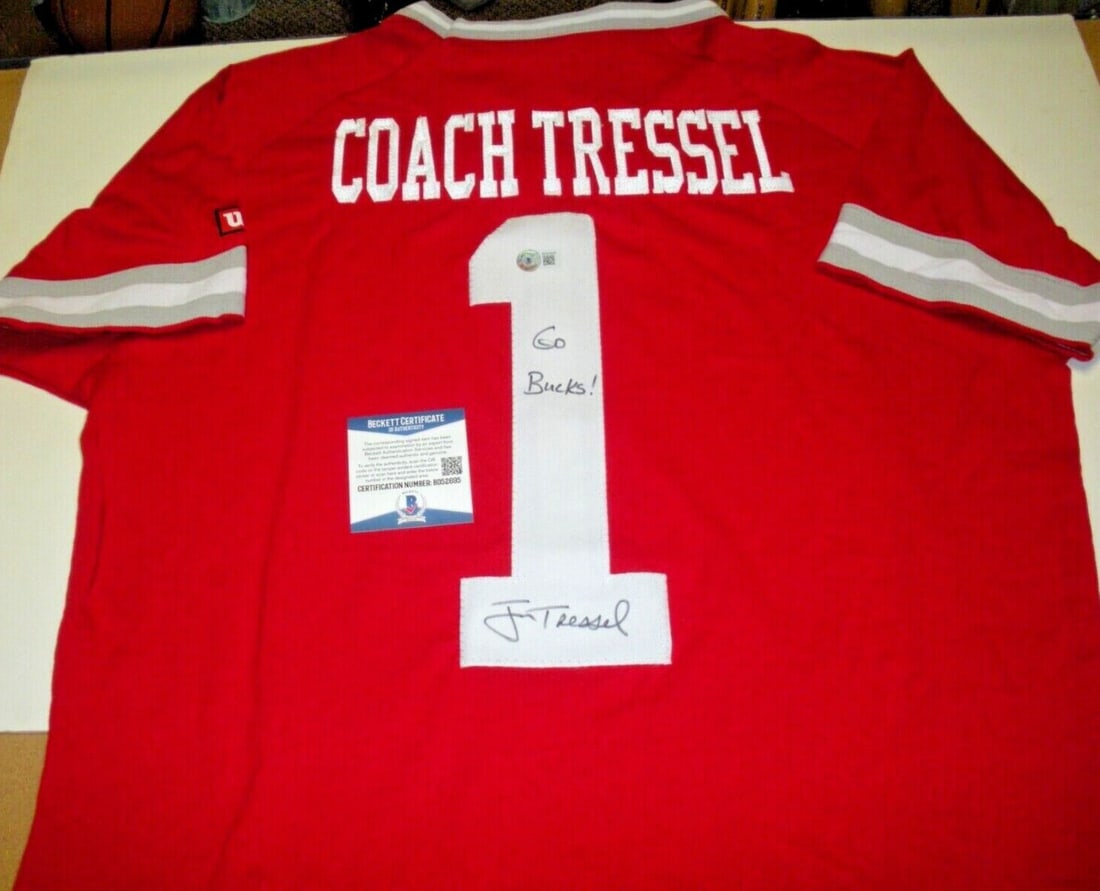 Jim Tressel Signed Official Wilson Ohio State Jersey with COA: Jim Tressel Signed Official Wilson Ohio State Jersey with COA This is an officially licensed Wilson jersey signed by Jim Tressel, the esteemed coach of the Ohio State Buckeyes. This collectible piece