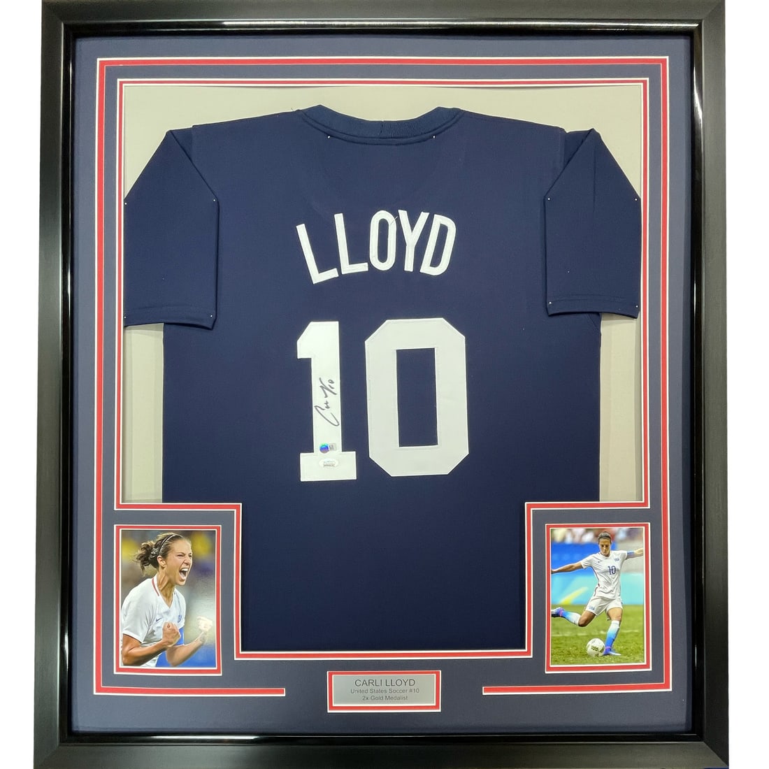 Framed Carli Lloyd Autographed USA World Cup Jersey with JSA COA 33x42: Framed Carli Lloyd Autographed USA World Cup Jersey with JSA COA 33x42 Celebrate the achievement of Carli Lloyd with this stunning framed autographed Navy Blue Team USA World Cup jersey. This original