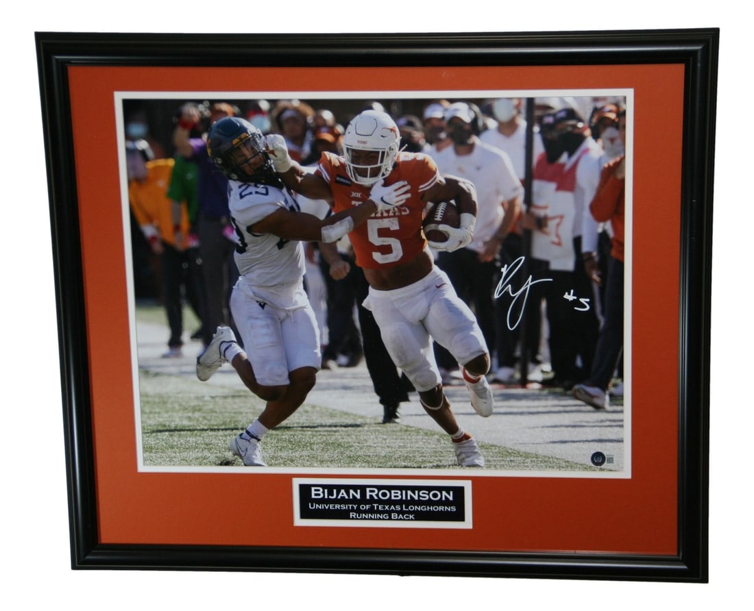 Framed 16x20 Photo Signed by Bijan Robinson with Beckett Authentication: Framed 16x20 Photo Signed by Bijan Robinson with Beckett Authentication This is a framed 16x20 photo of Bijan Robinson with the Texas Longhorns, personally autographed by the player. The signature has