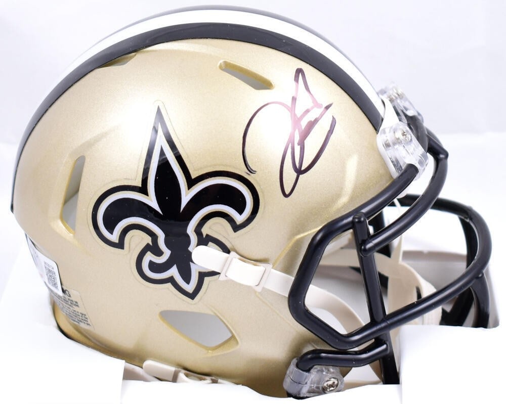 Derek Carr Signed New Orleans Saints Mini Helmet Beckett Authenticated: Derek Carr Signed New Orleans Saints Mini Helmet Beckett Authenticated This is a pre-owned mini helmet signed by Derek Carr, featuring the New Orleans Saints logo. The item is authenticated by Beckett