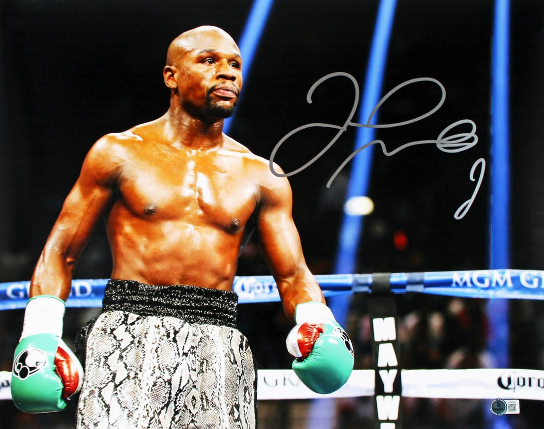 Floyd Mayweather Signed 16x20 Photo with Green Gloves Beckett Authenticated: Floyd Mayweather Signed 16x20 Photo with Green Gloves Beckett Authenticated This authentic 16x20 horizontal photo features Floyd Mayweather, one of boxing's greatest champions, captured in action with