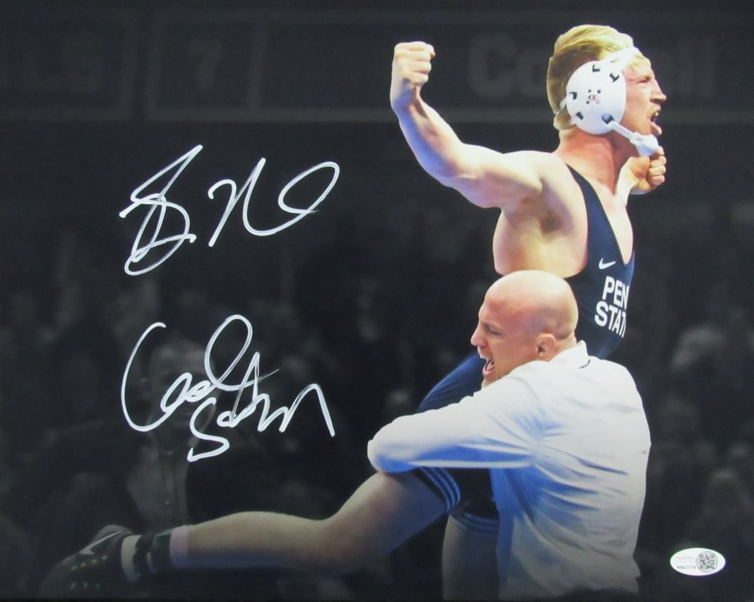 Bo Nickal Cael Sanderson Dual Signed 11x14 Photo JSA Authenticated Penn State Wrestling: Bo Nickal Cael Sanderson Dual Signed 11x14 Photo JSA Authenticated Penn State Wrestling This remarkable 11x14 photo features dual autographs from wrestling legends Bo Nickal and Cael Sanderson, both r