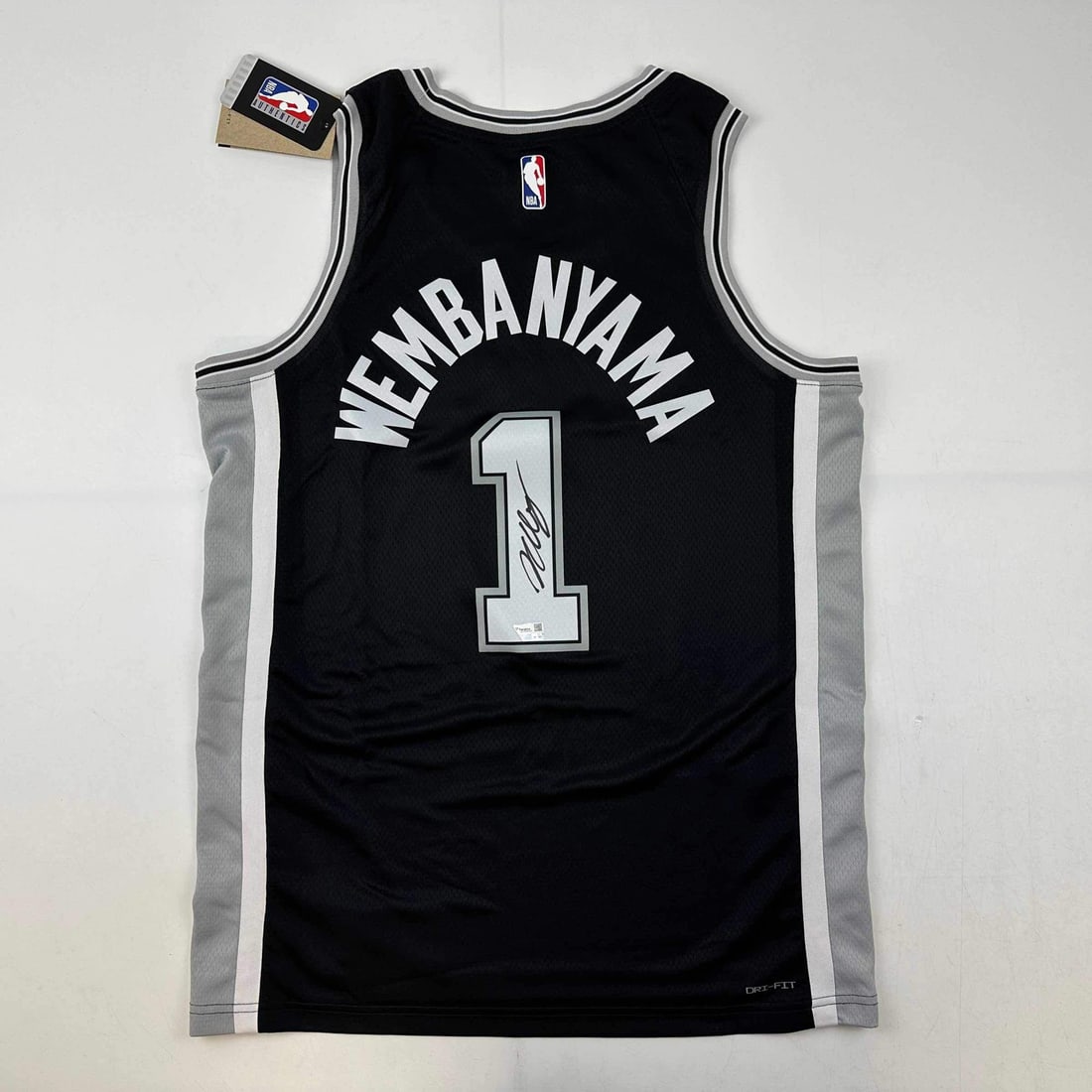 Victor Wembanyama Autographed San Antonio Spurs Black Jersey Fanatics COA: Victor Wembanyama Autographed San Antonio Spurs Black Jersey Fanatics COA This authentic black jersey features the signature of rising NBA star Victor Wembanyama, a player for the San Antonio Spurs. T