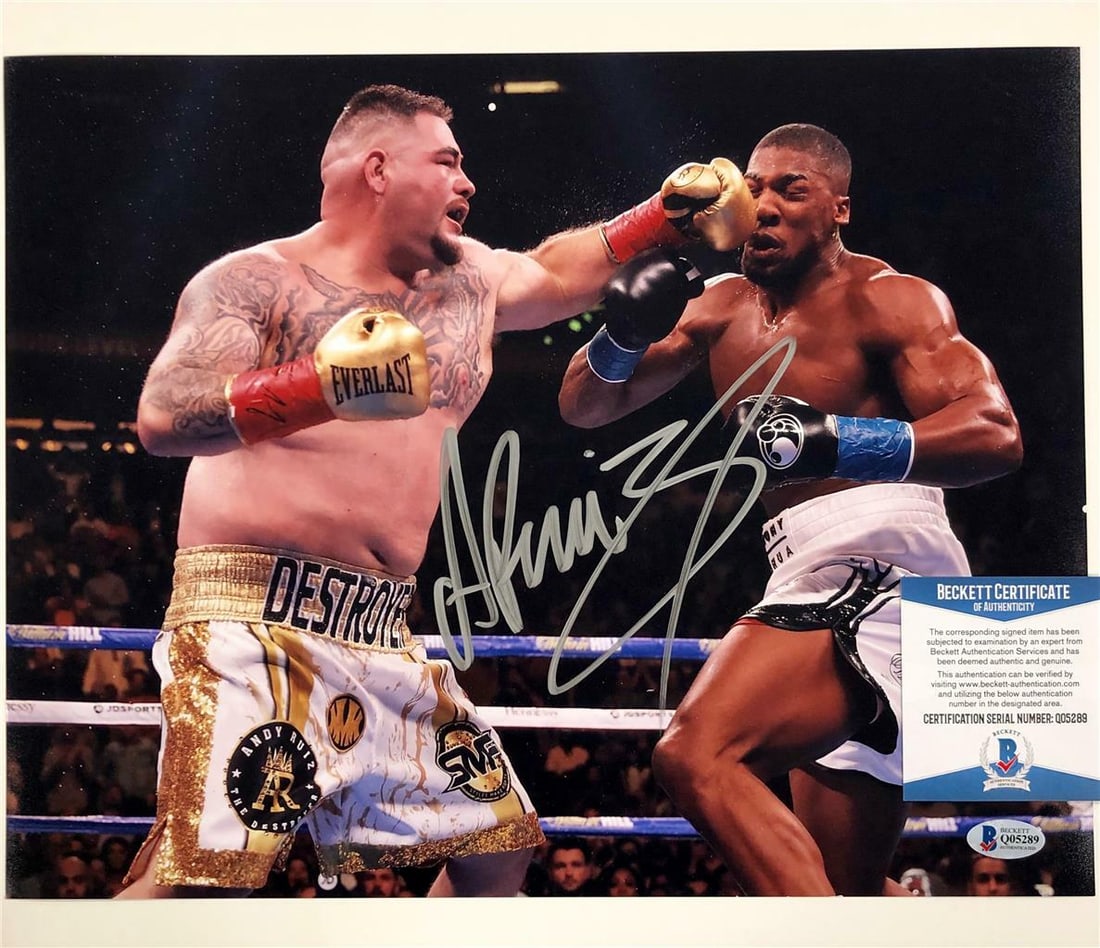 Andy Ruiz Jr Signed 11x14 Photo vs Anthony Joshua Beckett Authenticated: Andy Ruiz Jr Signed 11x14 Photo vs Anthony Joshua Beckett Authenticated This is an original signed 11x14 photo of Andy Ruiz Jr. taken during his match against Anthony Joshua. The autograph has been au