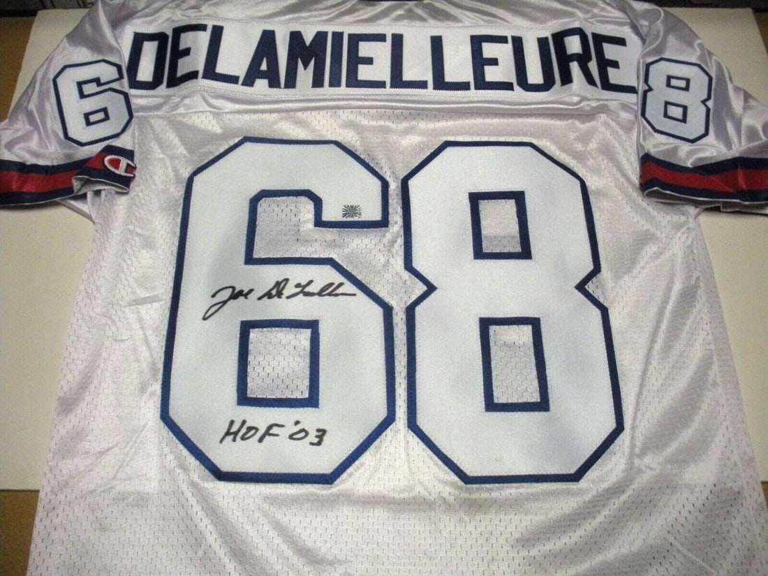 Joe DeLamielleure Signed Champion Jersey with COA NFL Football: Joe DeLamielleure Signed Champion Jersey with COA NFL Football This is an officially licensed Champion jersey signed by Joe Delamielleure, a notable player in NFL history. The jersey is pre-owned, sho