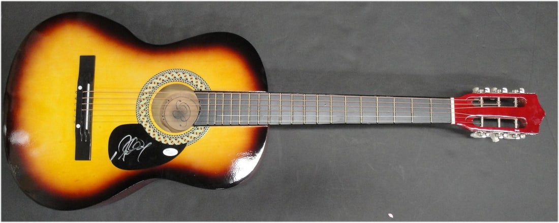 Richard Marx Autographed Acoustic Guitar JSA Authenticated: Richard Marx Autographed Acoustic Guitar JSA Authenticated This is an original acoustic guitar autographed by Richard Marx, a renowned rock star known for his hit songs and captivating performances. T