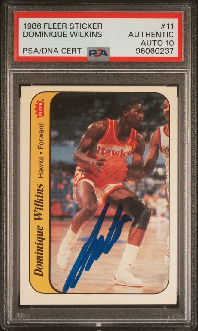 1986 Fleer Dominique Wilkins Signed Card #11 PSA Authenticated Hawks: 1986 Fleer Dominique Wilkins Signed Card #11 PSA Authenticated Hawks This collectible features a 1986 Fleer Sticker card of Dominique Wilkins, a legendary player for the Atlanta Hawks. The card is sig