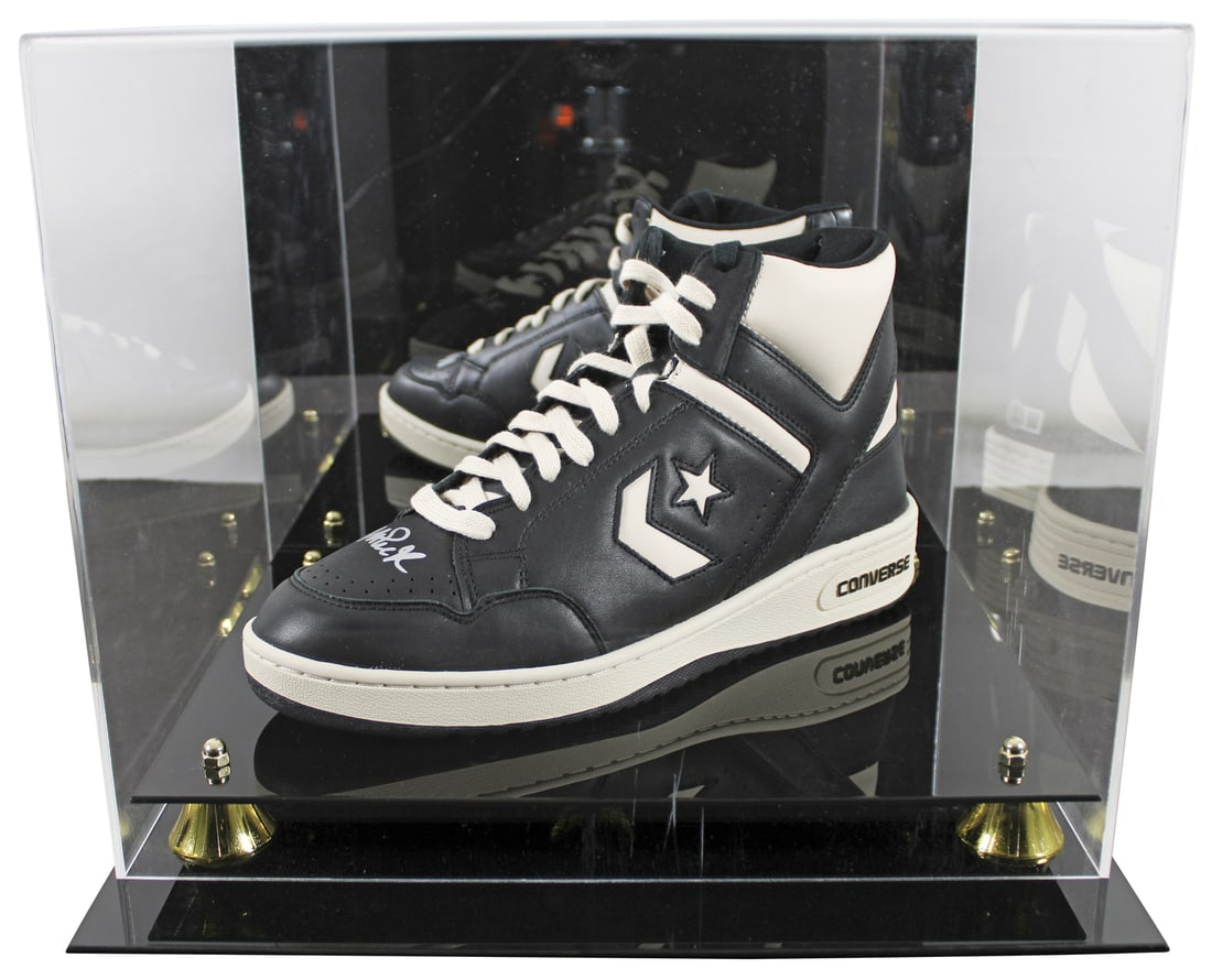 Magic Johnson Autographed Converse Weapon Shoe with Acrylic Case BAS: Magic Johnson Autographed Converse Weapon Shoe with Acrylic Case BAS Celebrate the legacy of Magic Johnson with this autographed left black and white Converse Weapon shoe, accompanied by a UV mirrored
