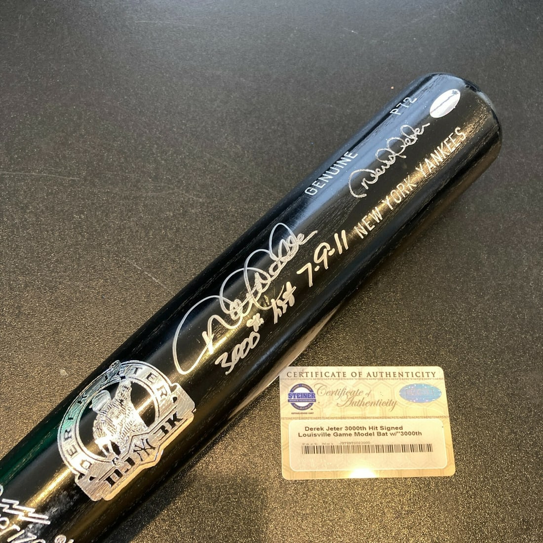 Derek Jeter Signed 3,000th Hit Commemorative Bat With Inscription Steiner COA: Derek Jeter Signed 3,000th Hit Commemorative Bat With Inscription Steiner COA This black Louisville Slugger P72 model bat commemorates Derek Jeter's 3,000th hit achieved on July 9, 2011. The bat is si