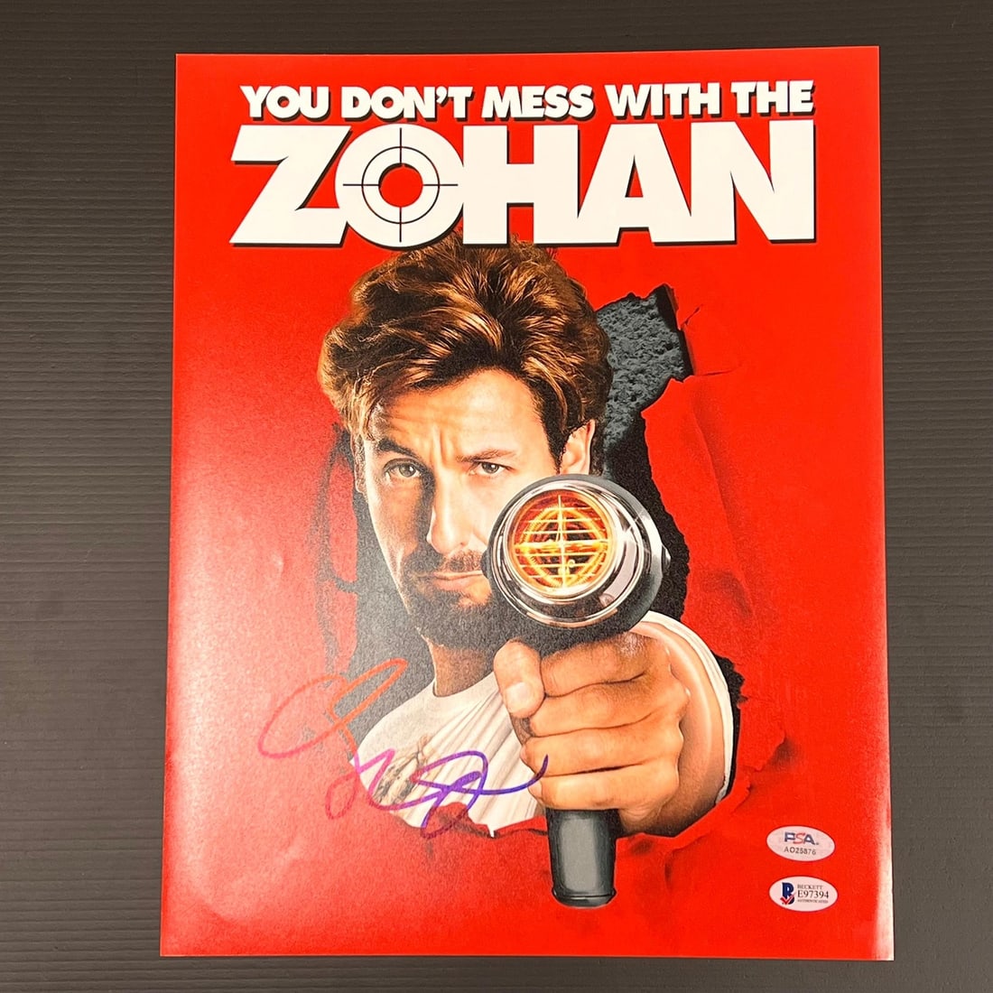 Adam Sandler Signed 11x14 Photo You Don't Mess With The Zohan PSA/DNA: Adam Sandler Signed 11x14 Photo You Don't Mess With The Zohan PSA/DNA This professionally printed 11x14 photograph features the signature of Adam Sandler, known for his role in the film "You Don't Mes
