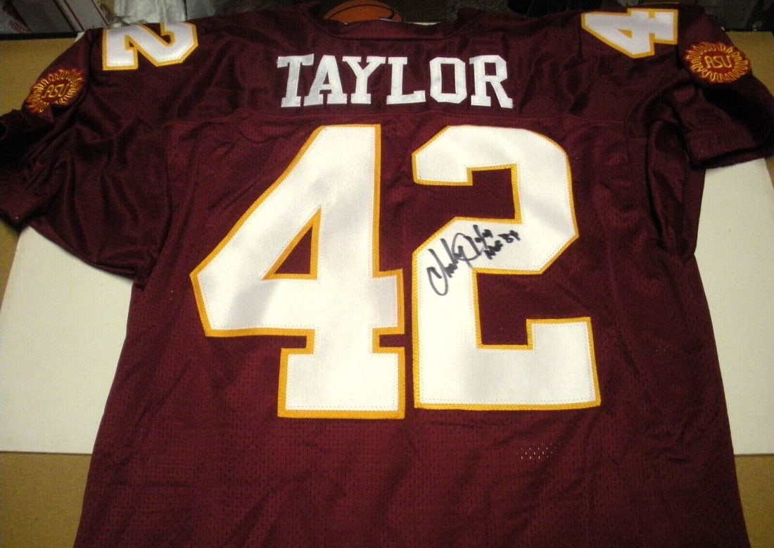 Charley Taylor Arizona State Sun Devils Signed Reebok Jersey with COA: Charley Taylor Arizona State Sun Devils Signed Reebok Jersey with COA This official Reebok jersey, signed by Charley Taylor, is a must-have for any Arizona State Sun Devils fan. It is an original item