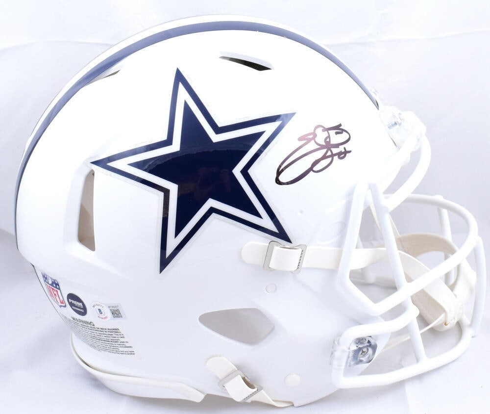 Emmitt Smith Signed Dallas Cowboys Speed Helmet Beckett Authenticated: Emmitt Smith Signed Dallas Cowboys Speed Helmet Beckett Authenticated This authentic full-size helmet features the signature of Emmitt Smith, a legendary player for the Dallas Cowboys in the NFL. The