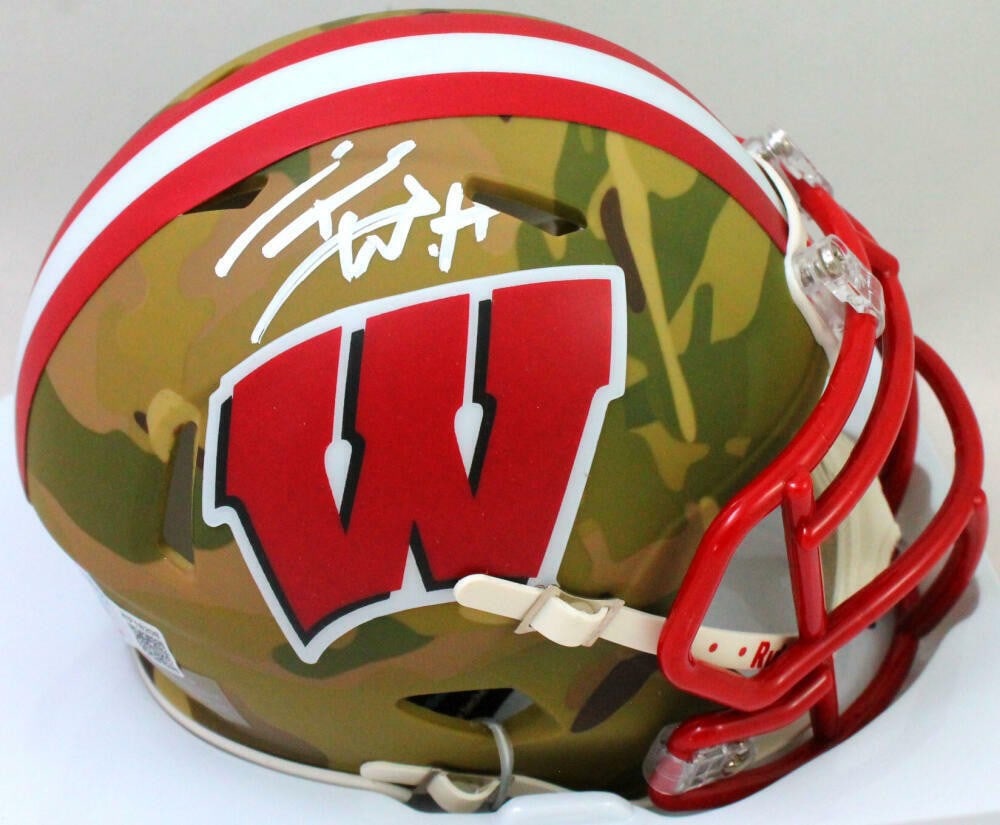 T.J. Watt Autographed Wisconsin Badgers Camo Mini Helmet Beckett Authenticated: T.J. Watt Autographed Wisconsin Badgers Camo Mini Helmet Beckett Authenticated This is an original Wisconsin Badgers camo speed mini helmet signed by T.J. Watt, showcasing his authentic autograph veri