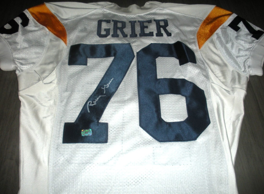 Rosey Grier Signed Los Angeles Rams Nike Jersey with COA: Rosey Grier Signed Los Angeles Rams Nike Jersey with COA This official Nike jersey features a striking design representing the Los Angeles Rams, enhanced by the authentic signature of Rosey Grier. As