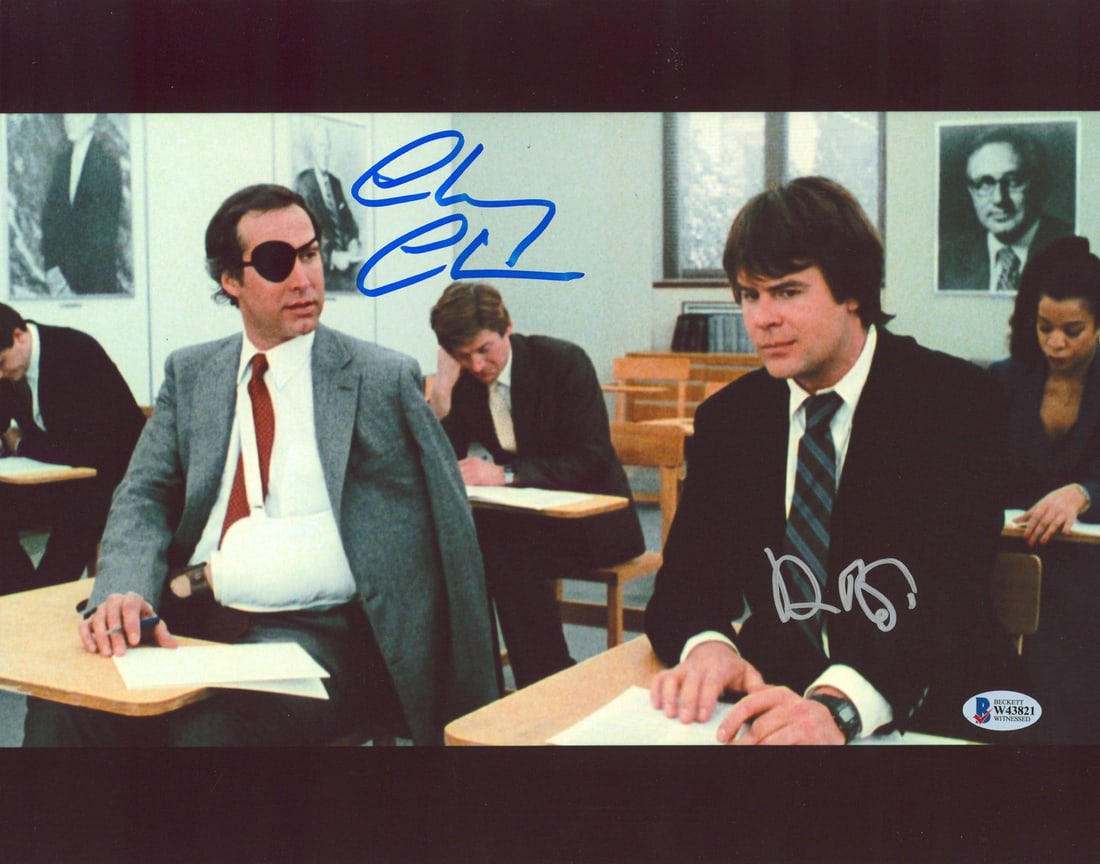 11x14 Spies Like Us Photo Signed by Chevy Chase and Dan Aykroyd Beckett Witnessed: 11x14 Spies Like Us Photo Signed by Chevy Chase and Dan Aykroyd Beckett Witnessed This is an original 11x14 photograph from "Spies Like Us" featuring a classroom scene, personally signed by Chevy Chas