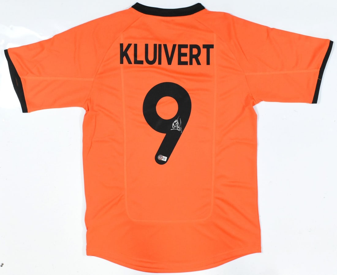 Patrick Kluivert Signed Netherlands Home Jersey #9 Beckett Holo: Patrick Kluivert Signed Netherlands Home Jersey #9 Beckett Holo Celebrate the legacy of Patrick Kluivert with this autographed Netherlands home soccer jersey. Featuring the iconic #9, this original je
