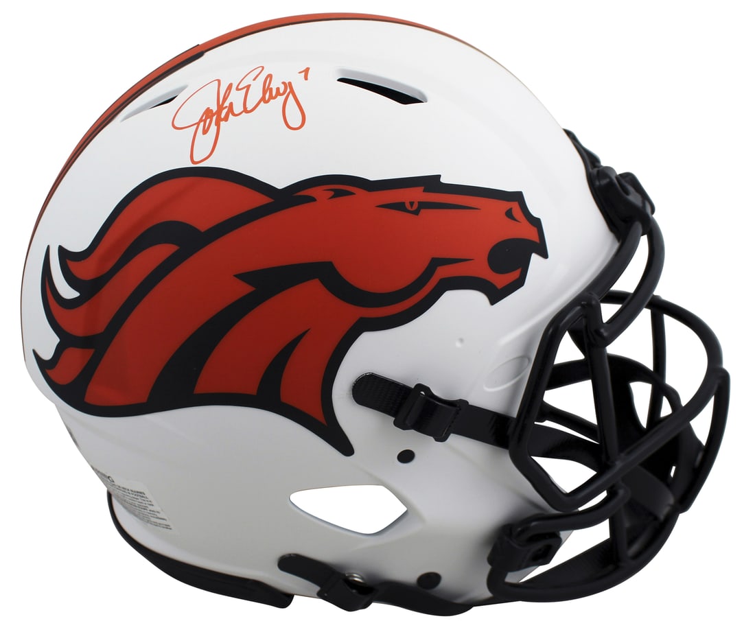 John Elway Autographed Denver Broncos Lunar Full Size Helmet BAS Witnessed: John Elway Autographed Denver Broncos Lunar Full Size Helmet BAS Witnessed This is an autographed full-size speed Proline helmet featuring John Elway of the Denver Broncos. The helmet, a stunning alte