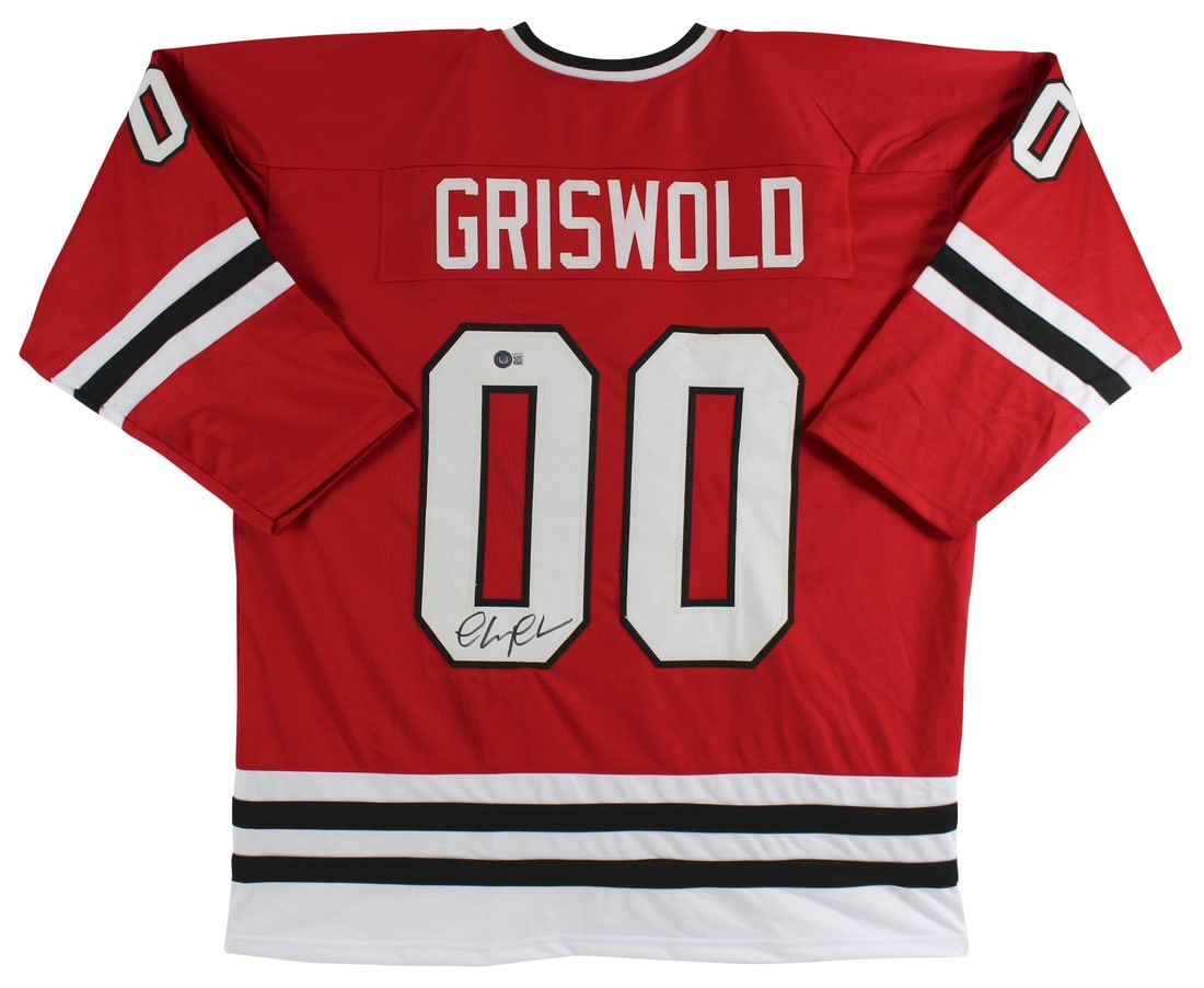 Chevy Chase Signed Red Santa Clark Jersey BAS Authenticated: Chevy Chase Signed Red Santa Clark Jersey BAS Authenticated Celebrate the holiday spirit with this authentic red Santa Clark jersey personally signed by Chevy Chase, famed for his role in National Lam