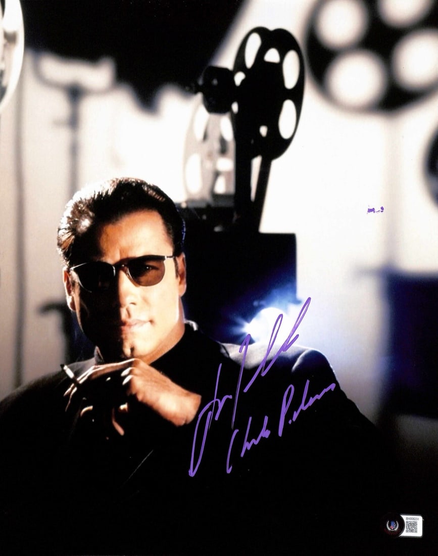 John Travolta Signed 11x14 Photograph as Chili Palmer BECKETT Certified: John Travolta Signed 11x14 Photograph as Chili Palmer BECKETT Certified This is an autographed 11x14 photograph of John Travolta as "Chili Palmer" from the film Get Shorty. The photograph features Tra