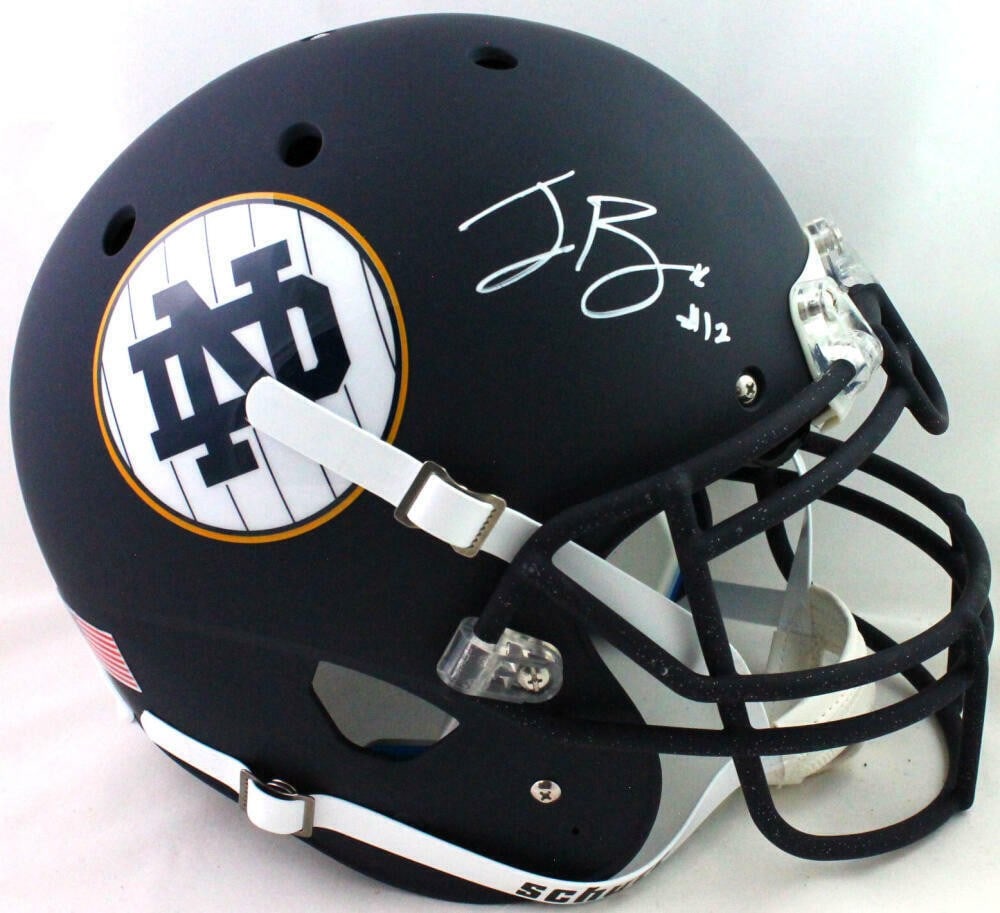 Ian Book Signed Notre Dame Schutt Authentic Helmet Beckett Authenticated: Ian Book Signed Notre Dame Schutt Authentic Helmet Beckett Authenticated This authentic Schutt football helmet is signed by Ian Book, former quarterback for the Notre Dame Fighting Irish. It features