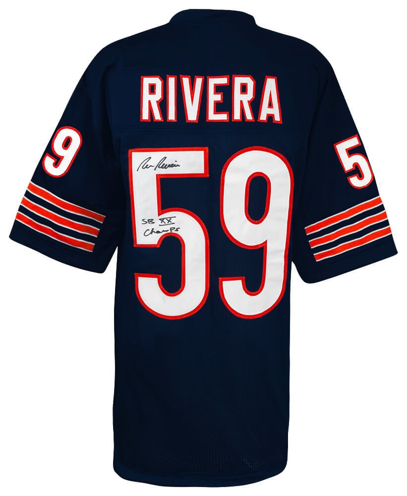 Ron Rivera Signed Chicago Bears Jersey SB XX Champs with COA: Ron Rivera Signed Chicago Bears Jersey SB XX Champs with COA This navy custom football jersey, signed by Ron Rivera, features the inscription 'SB XX Champs,' commemorating his achievement as a champio
