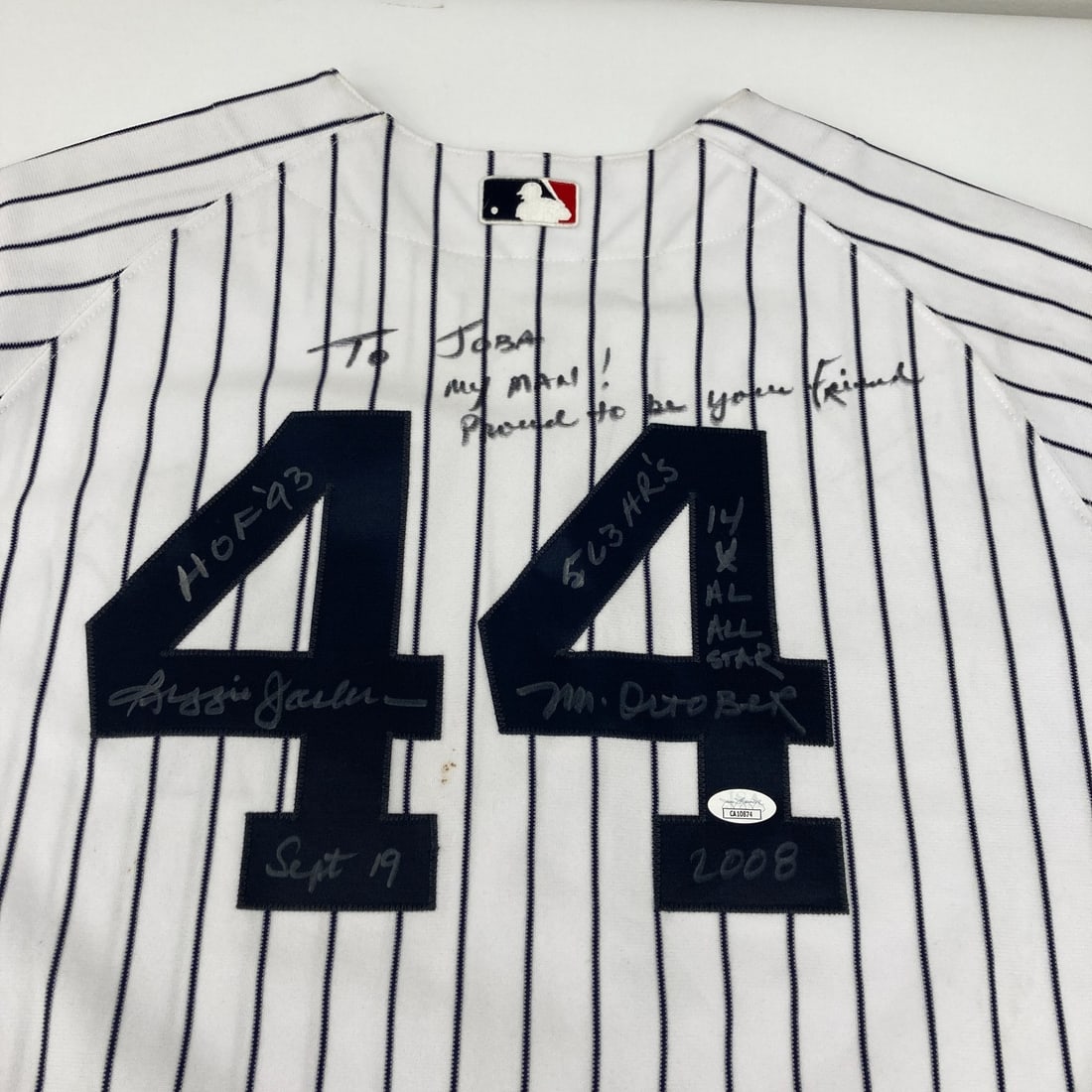 Reggie Jackson Signed Yankees Jersey with JSA Authentication: Reggie Jackson Signed Yankees Jersey with JSA Authentication This classic pinstripe New York Yankees jersey, originally worn by the legendary Reggie Jackson, is a striking collectible piece for any ba