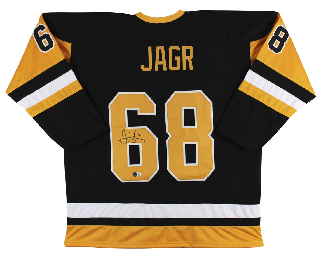 Jaromir Jagr Signed Black Pro Jersey with Yellow Numbers Beckett Authenticated: Jaromir Jagr Signed Black Pro Jersey with Yellow Numbers Beckett Authenticated This authentic black pro-style jersey features yellow numbers and is personally signed by legendary player Jaromir Jagr o