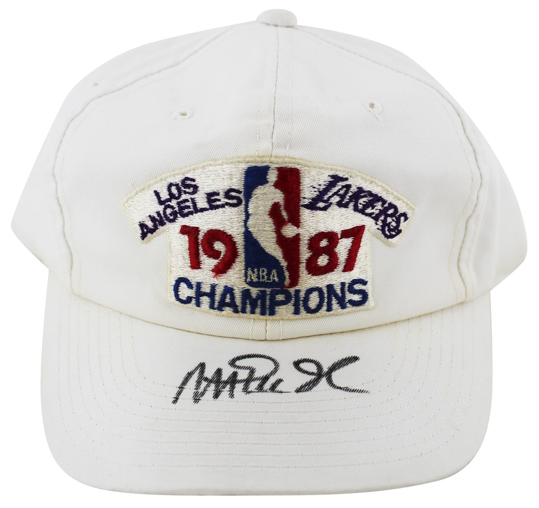 Magic Johnson Autographed 1987 Lakers World Champions Hat Beckett Authenticated: Magic Johnson Autographed 1987 Lakers World Champions Hat Beckett Authenticated This autographed 1987 World Champions white hat has been personally signed by Magic Johnson, a legendary player of the L