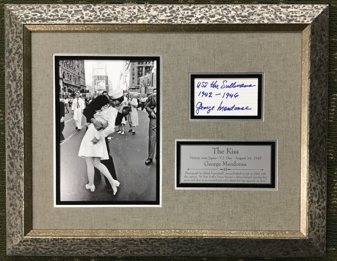 George Mendonsa Signed V-J Day Custom Framed Display JSA Authenticated: George Mendonsa Signed V-J Day Custom Framed Display JSA Authenticated This stunning custom framed WWII V-J Day display features a signed photograph by George Mendonsa, famously known as the Kissing S