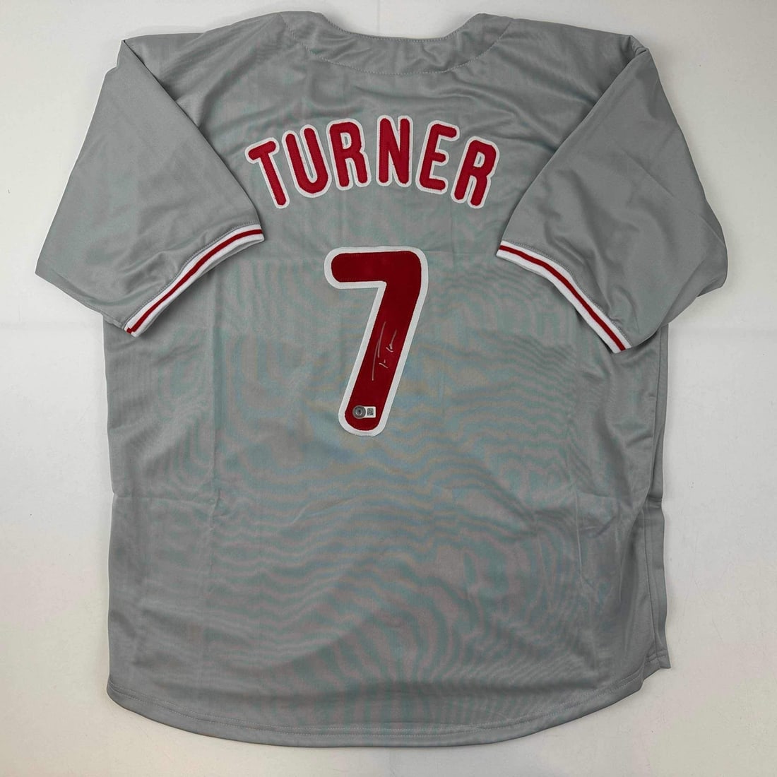 Trea Turner Autographed Philadelphia Phillies Grey Jersey Beckett COA: Trea Turner Autographed Philadelphia Phillies Grey Jersey Beckett COA This Philadelphia Phillies grey baseball jersey is autographed by Trea Turner, adding significant value as a collectible item. The
