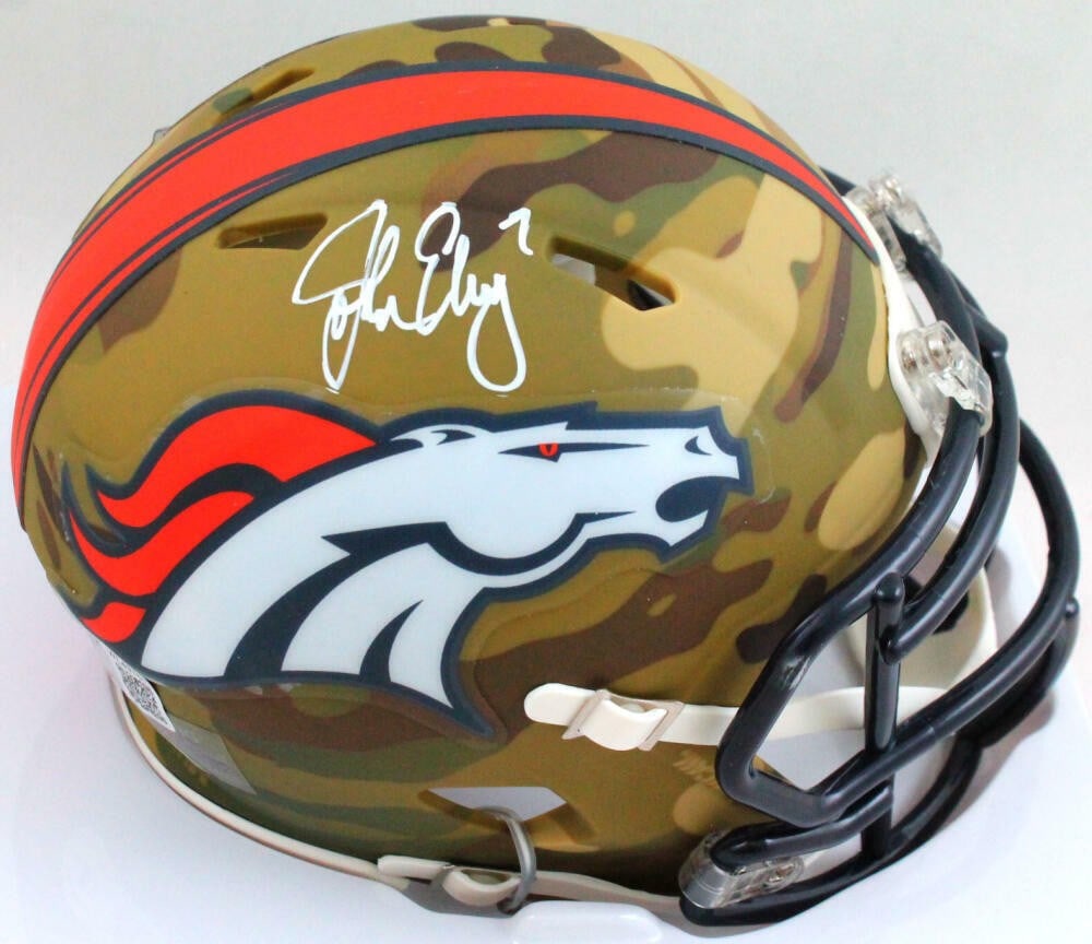 John Elway Signed Denver Broncos Camo Mini Helmet Beckett Authenticated: John Elway Signed Denver Broncos Camo Mini Helmet Beckett Authenticated This Denver Broncos mini helmet features the iconic autograph of Hall of Fame quarterback John Elway. An original collectible, t