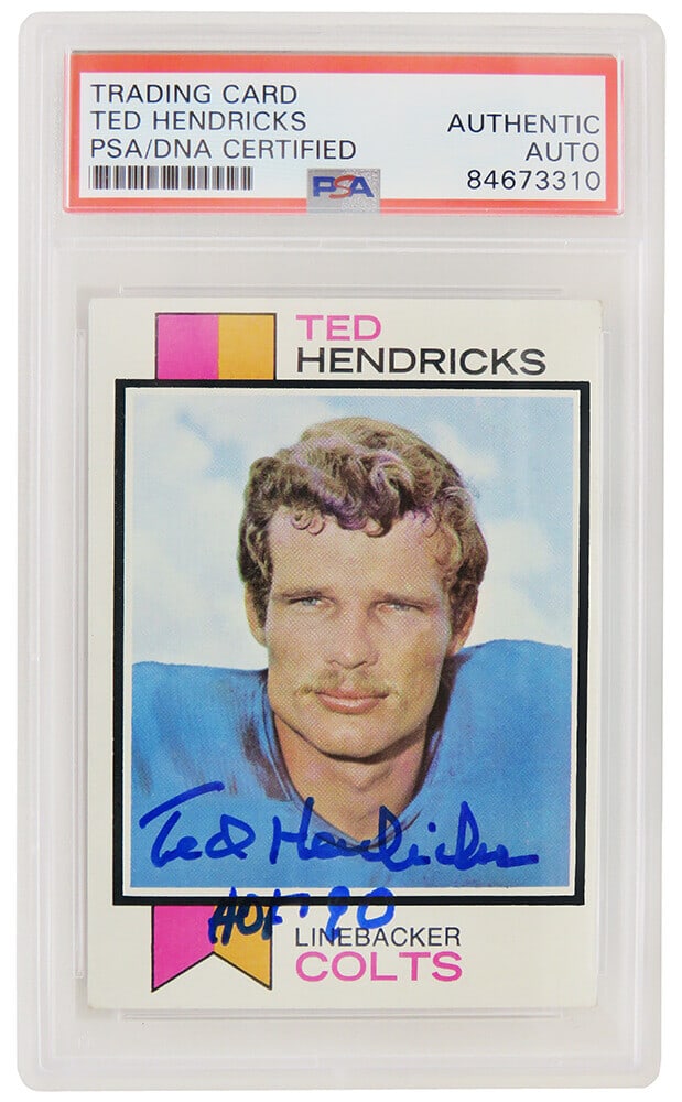 Ted Hendricks Autographed 1973 Topps Card #430 HOF 90 PSA/DNA: Ted Hendricks Autographed 1973 Topps Card #430 HOF 90 PSA/DNA Celebrate the legacy of NFL legend Ted Hendricks with this autographed 1973 Topps football card #430. This original card features the Hall