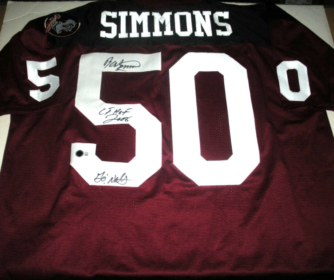 Ron Simmons Signed Florida State Majestic Jersey with Beckett COA: Ron Simmons Signed Florida State Majestic Jersey with Beckett COA This officially licensed Majestic jersey, signed by Ron Simmons, is a must-have for any football fan and collector. Perfect for showca