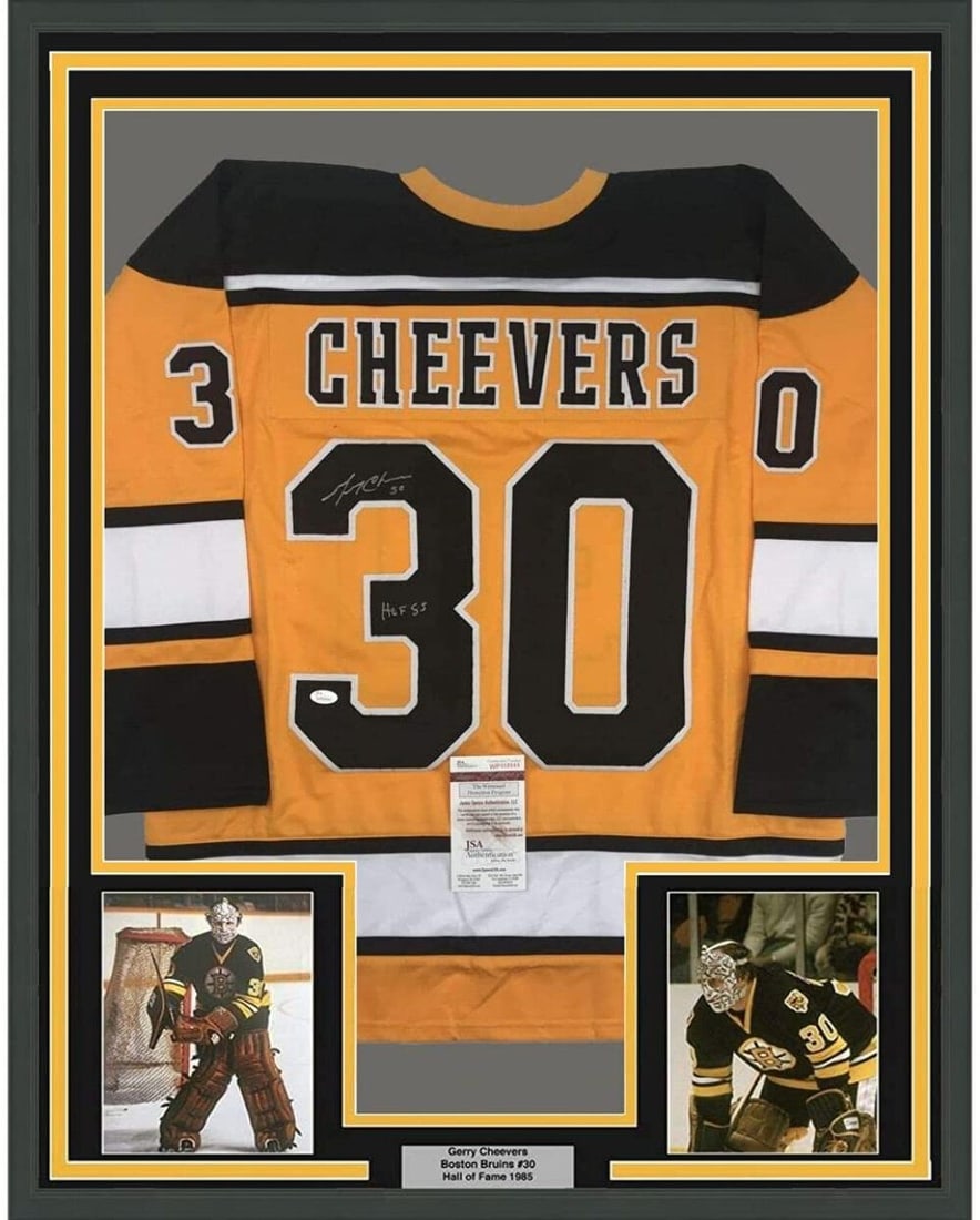 Framed Autographed Gerry Cheevers Boston Bruins Jersey with JSA COA: Framed Autographed Gerry Cheevers Boston Bruins Jersey with JSA COA Showcase your love for hockey with this professionally framed and autographed Gerry Cheevers jersey from the Boston Bruins. Measurin