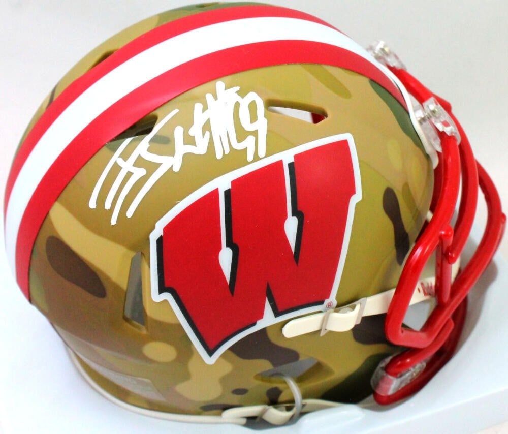 JJ Watt Signed Wisconsin Badgers Camo Mini Helmet JSA Authenticated: JJ Watt Signed Wisconsin Badgers Camo Mini Helmet JSA Authenticated This Wisconsin Badgers camo mini helmet is autographed by NFL star JJ Watt, a standout player known for his impressive career. The h