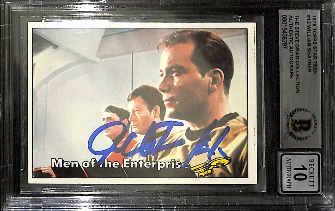 William Shatner Signed 1976 Topps Star Trek #13 Autograph Grade 10: William Shatner Signed 1976 Topps Star Trek #13 Autograph Grade 10 This is a 1976 Topps Star Trek #13 trading card featuring Captain Kirk, signed in blue permanent marker by William Shatner. The autog